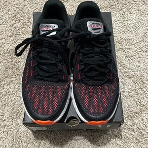 BRAND NEW. UNDER ARMOUR YOUTH SIZE 4Y SHOES. BLACK/ORANGE/RED